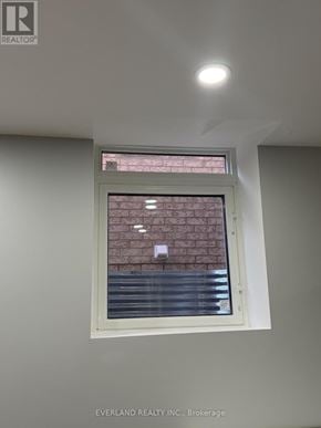 Richmond Hill (Rouge Woods) apartment for rent - A window with a view of a brick wall.