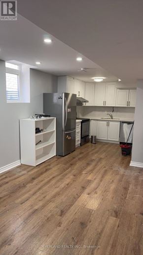 Richmond Hill (Rouge Woods) apartment for rent - A kitchen with a refrigerator, cabinets, and a broom.