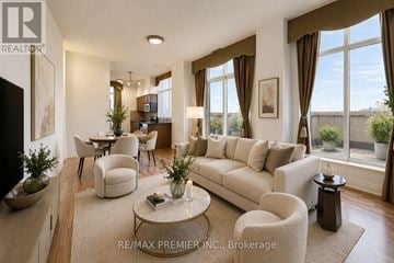 Vaughan (Maple) condo for rent - A well-lit living room with a large window and a view of the outdoors.
