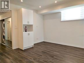 Mississauga (Mineola) townhouse for rent - A room with a washing machine and a cabinet.