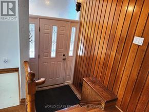 Toronto (Bendale) apartment for rent - A wooden hallway with a bench and a door.