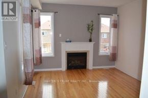 Vaughan (Patterson) apartment for rent - A room with a fireplace and a plant on top of it.