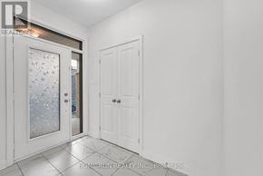 Ottawa apartment for rent - A white door with a glass window is in a room with a white wall.
