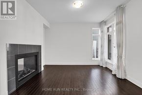 Ottawa apartment for rent - A room with a fireplace and a window with curtains.