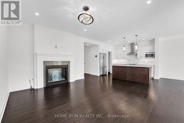 Ottawa apartment for rent - A spacious living room with a fireplace and a large painting on the wall.