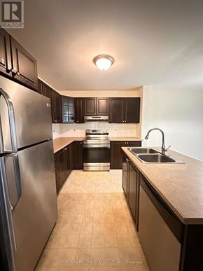 Ottawa apartment for rent - A kitchen with a stainless steel refrigerator and a sink.