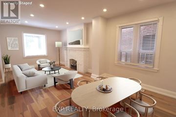 Toronto (Mount Pleasant East) apartment for rent - A living room with a fireplace and a dining table set for two.