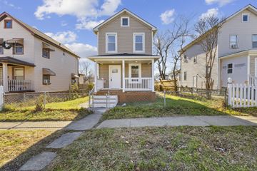 Brooklyn apartment for rent - A house with a white picket fence in front of it.