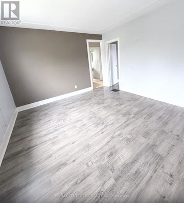 London South (South I) duplex for rent - A living room with a grey couch and a wooden coffee table.