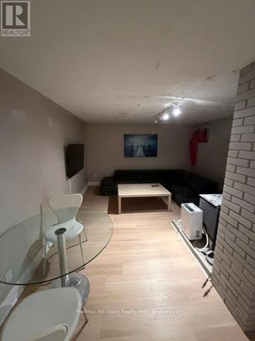 Kawartha Lakes (Fenelon Falls) apartment for rent - A living room with a glass table and chairs.