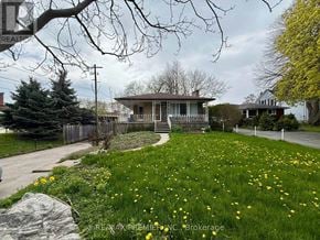 St. Catharines (Fairview) apartment for rent - A house with a lawn in front of it.