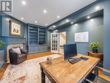 Toronto (Forest Hill South) apartment for rent - A room with a desk, chair, and a painting on the wall.
