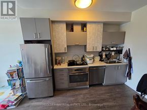 Markham (Unionville) condo for rent - A kitchen with a refrigerator, oven, and sink.