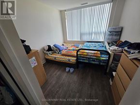 Markham (Unionville) condo for rent - A bedroom with a bed, dresser, and window with blinds.