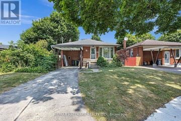 Toronto (Bendale) apartment for rent - A house with a red brick exterior and a white door is surrounded by greenery.