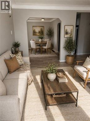 Hamilton apartment for rent - A living room with a white couch, a wooden coffee table, and a dining table with chairs.