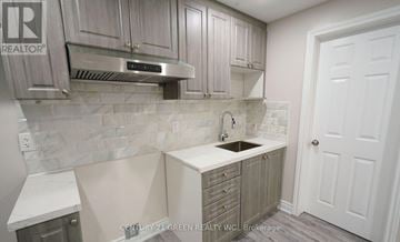 Brampton (Brampton North) apartment for rent - A kitchen with a sink and cabinets.