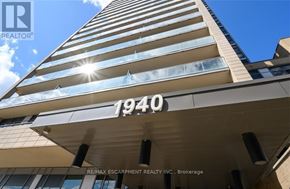Burlington (Uptown) condo for rent - A tall building with the number 1940 on it.