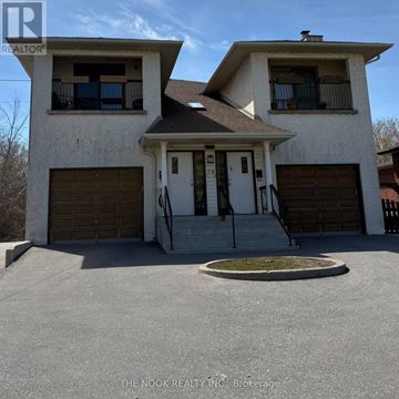 Oshawa (Vanier) multi-family for rent - A two-story house with a garage is for sale.