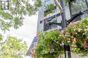 Hamilton (Beasley) condo for rent - A street sign for International Village Street and King Street is shown.