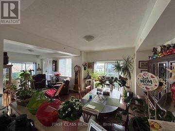 Mississauga (Churchill Meadows) condo for rent - A living room with a dining table and chairs.