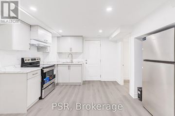 Toronto (Parkwoods-Donalda) apartment for rent - A kitchen with white cabinets and appliances is on the market.