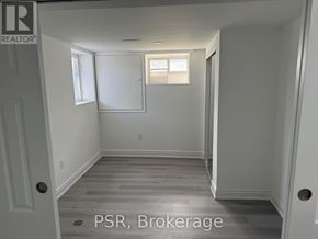 Toronto (Parkwoods-Donalda) apartment for rent - A modern kitchen with a stainless steel oven and white cabinets.