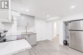 Toronto (Parkwoods-Donalda) apartment for rent - A kitchen with a refrigerator and cabinets.