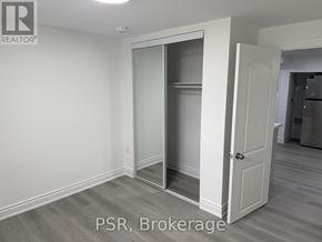 Toronto (Parkwoods-Donalda) apartment for rent - A kitchen with a stove top oven and a refrigerator.