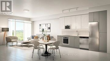 Hamilton (Kirkendall) condo for rent - A modern kitchen with stainless steel appliances and a dining table set for four.