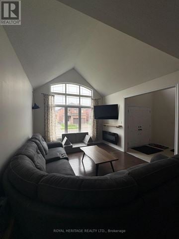 Brock (Beaverton) apartment for rent - A living room with a grey couch and a television.