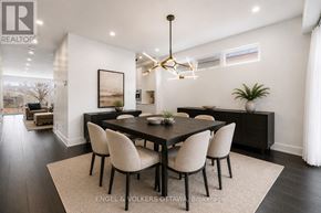 Ottawa apartment for rent - A modern dining room with a large table and chairs.