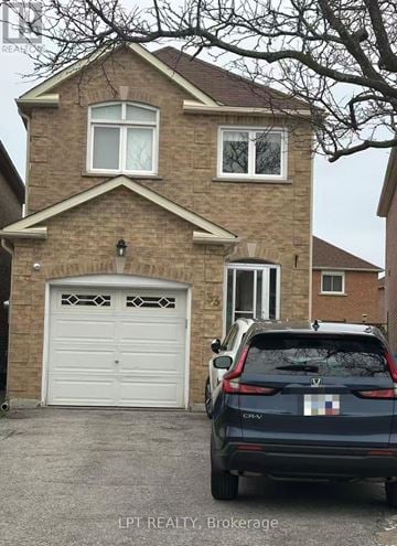 Markham (Milliken Mills East) apartment for rent - A house with a car parked in front of it.