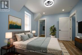 Asphodel-Norwood (Norwood) apartment for rent - A bedroom with a bed, nightstands, and a painting on the wall.