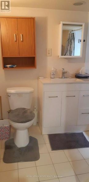 Toronto (East End-Danforth) apartment for rent - A bathroom with a toilet, sink, and medicine cabinet.