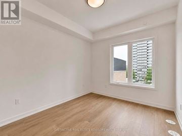 Toronto (L'amoreaux) townhouse for rent - A room with a window showing a view of a building outside.