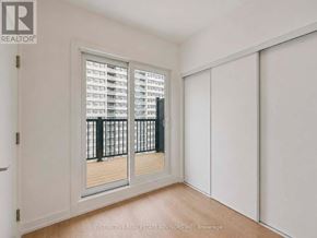 Toronto (L'amoreaux) townhouse for rent - A room with a sliding door and a balcony with a railing.