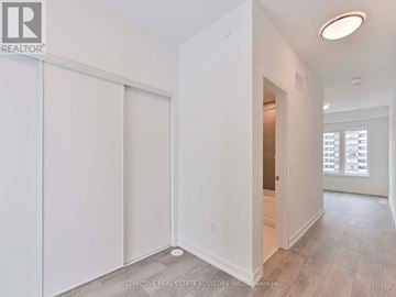 Toronto (L'amoreaux) townhouse for rent - A white room with a sliding door and a window.