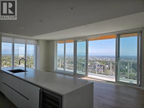 Vancouver apartment for rent - A modern kitchen with a view of the city.