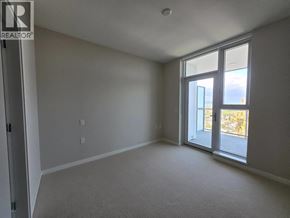 Vancouver apartment for rent - A room with a sliding glass door leading to a balcony.