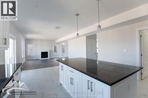 Chatham apartment for rent - A spacious kitchen with white cabinets and a black countertop.