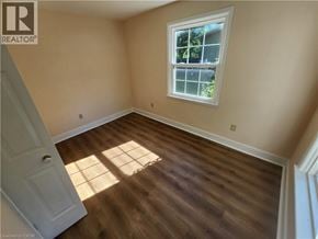 Ancaster apartment for rent - A room with a window and wooden flooring.