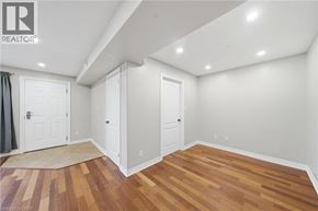 Paris condo for rent - A room with wooden floors and white walls.