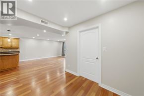 Paris condo for rent - A room with wooden floors and a white door.