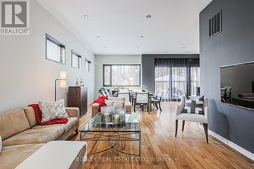 Toronto (Islington-City Centre West) apartment for rent - A modern living room with a glass coffee table and a large window.