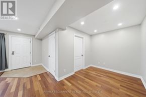 Brant (Paris) condo for rent - A room with wooden flooring and white walls.