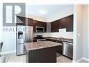 Hamilton (Carpenter) townhouse for rent - A kitchen with a granite countertop and stainless steel appliances.