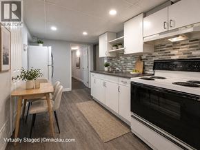 Burnaby apartment for rent - A modern kitchen with a dining table and chairs.