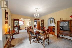 Whitchurch-Stouffville apartment for rent - A dining room with a wooden table and chairs.