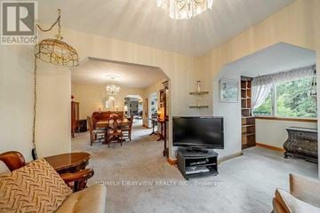 Whitchurch-Stouffville apartment for rent - A living room with a television and a couch.